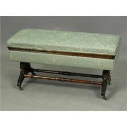 A late Victorian beechwood? duet stool, the hinged top on turned and carved supports united wi...