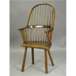 An early 19th century country Windsor armchair Est. 200/300...