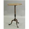Image 1 : A 19th century oval tripod table with a spiral twist and carved column, on slender legs, 74cm...
