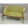 Image 1 : A mid Victorian walnut settee with a serpentine front, carved arms and cabriole legs, 145cm wi...