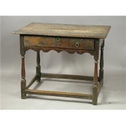 A late 17th century oak sidetable, with a drawer on turned legs, 86cm wide Est. 300/400...