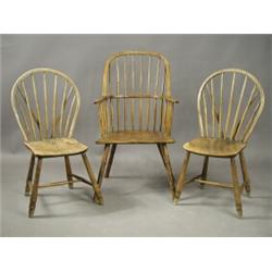 A pair of early 19th century rustic stick back Windsor chairs and an armchair Est. 200/400...