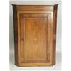 Image 1 : A George III mahogany hanging corner cupboard, opening to reveal three shaped shelves, 113cm<b...