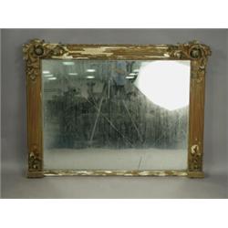 A late 19th century carved and gilt overmantel mirror, (glass cracked) 147 x 110cm Est. 300...
