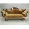 Image 1 : A Victorian carved mahogany scroll end settee, with a shaped back, carved with flowerheads and...