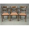 Image 1 : Five Regency mahogany bar back dining chairs with carved centre rails, drop in seats and sabre...