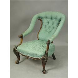 A Victorian rosewood open armchair with carved decoration, (with damage) Est. 200/300...