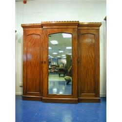 A Victorian mahogany breakfront wardrobe, with a castellated cornice, 2.08m wide x 2.08m high<...
