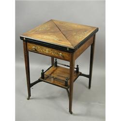 An Edwardian inlaid rosewood envelope cardtable with a drawer on four square tapering legs and...