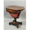 Image 1 : A Victorian rosewood worktable, the top with 'D' ends and a fitted drawer over a pleated silk...