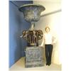 Image 1 : A large modern fibre glass urn with an imitation marble and bronze finish, the campana shaped...