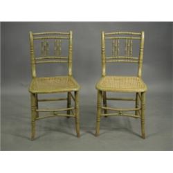 A pair of simulated bamboo side chairs with cane seats Est. 100/150...