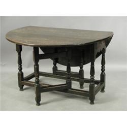 A late 17th/early 18th century oval oak gateleg table, with two drawers, later alterations, 11...