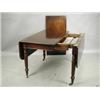 Image 1 : A Victorian mahogany drop leaf extending dining table with an unusual draw leaf action and a s...