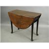 Image 1 : An 18th century oval mahogany drop leaf table, with turned tapering legs and pad feet, 92 x 12...