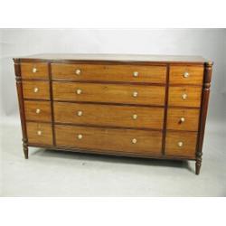An early 19th century mahogany cabinet, in the manner of Gillows, with four long and five smal...