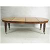 Image 1 : A Victorian mahogany extending dining table, with two extra leaves, supported on tapering reed...