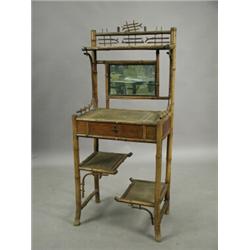 A bamboo washstand with a mirror back a frieze drawer and two undertiers, 57cm wide Est. 80...