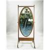 Image 1 : An Edwardian mahogany cheval mirror with an oval glass in a reeded frame Est. 200/400...