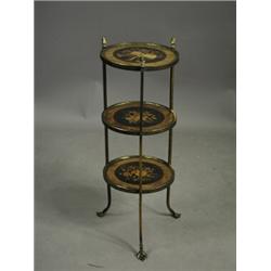 A Victorian three tier eterge each shelf with a central inlaid panel within a walnut border, t...