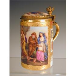 A Vienna style porcelain lidded mug, with a painted panel and lid, and brass finger thumb piece p...