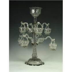 A Georgian faceted cut glass eight branch epergne with hanging baskets (repaired base, branch and...