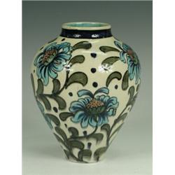 A Burmantofts Faience Persian-style vase of ovoid form, painted with stylised flowers, impressed...
