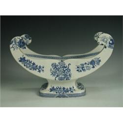 A blue and white cheese cradle, unmarked (two hairlines, chipped), 30.5cm wide Est. 250/280...