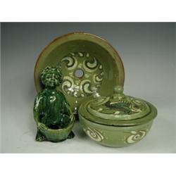 A Brannam soap dish, with sgraffito fish designs, together with a green glazed art pottery salt (...