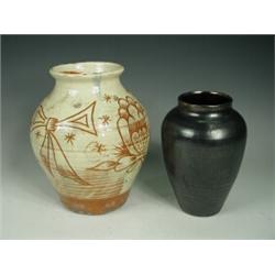 A North Devon slipware vase with sgraffito decoration together with a Dicker vase with lustre dec...