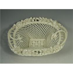 A mid 20th century Belleek porcelain oval "Henshall's Twig" pattern 4 strand basket, applied pad...