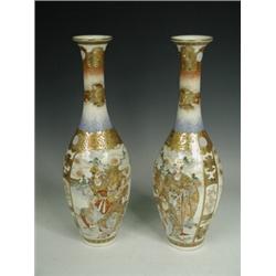 A pair of Meiji period Satsuma vases each with two individual panels decorated with two male figu...