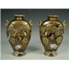 Image 1 : A pair of Satsuma vases with interesting mask handles and decorated with figures, heightened in g...