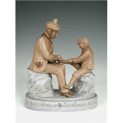 A late 19th/early 20th century Continental porcelain figure group modelled as a Scotsman and a yo...