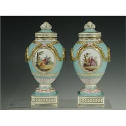 A pair of Berlin vases and covers with over-painted panels and gilt mouldings, (both covers resto...