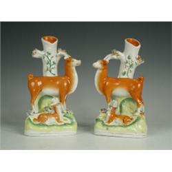 A pair of Victorian Staffordshire doe and fawn spill vases (one fawn restored), 17cm high Est. 80...