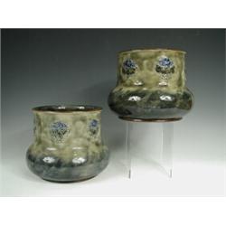 A pair of Royal Doulton stoneware jardiniFres with impressed P & O insignia to base, (one with cr...