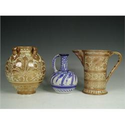 Two Hispano Moresque style lustre items, a jug and a vase both marked to the base together with a...