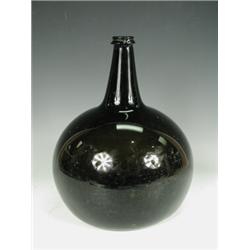 An 18th century green glass bulbous wine bottle, 23cm diameter, 28cm high Est. 80/120...