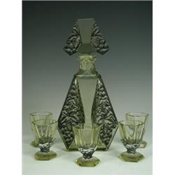 An Art Deco green glass liqueur set with a decanter and five glasses possibly Hungarian, 24cm hig...