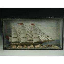 A diorama in the form of a three masted sailing ship in a glazed cabinet (A/F), 73cm wide Est. 22...