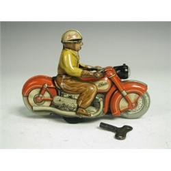 A Schuco 'Charly' 1005 clockwork tinplate motorcycle rider Est. 60/100...