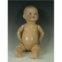An Armand Marseille Bisque head doll, with blue sleeping eyes, open mouth, composition body marke...