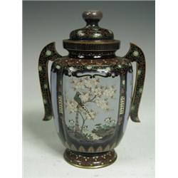 A late 19th century Japanese cloisonnT vase and cover with twin handles decorated in various colo...