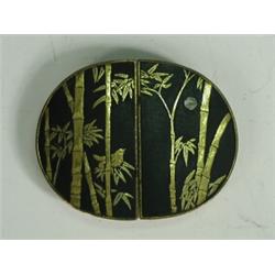 An early 20th century Komai type buckle decorated in gilt with a sparrow sitting on a branch on b...