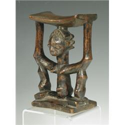 A Zulu neck rest, 2nd half 19th century, carved wood, 17cm high Est. 200/300...