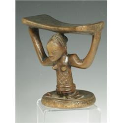 A Zulu neck rest, 2nd half 19th century, carved wood, 16cm high Est. 200/300...