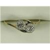 Image 1 : A diamond crossover ring illusion set in white with two stones of approx 0.15ct each to an 18ct y...