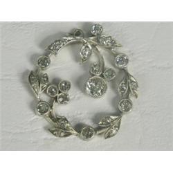 An Edwardian diamond pendant set with a total of approx 1.65cts of old cut stones, 2.5cm in diame...