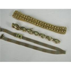 Three bracelets; two 9ct (one two-tone) the other yellow metal (tests 15ct) Est. 100/150...